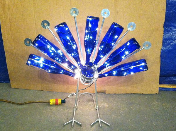This peacock wine bottle holder with lights is a great Christmas gift. 