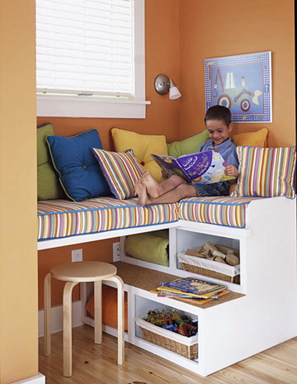 Stairs as Storage. This unique storage unit doubles as fun seating for kids, who can climb up to reach the cozy cushions above. The open shelves are perfect for housing blankets that can be easily obtained on those chillier days.
