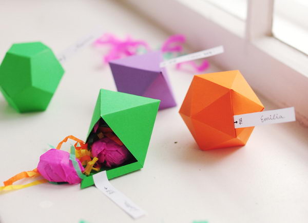 DIY Geometric Favor Boxes. These incredible geometric faceted favor boxes (polyhedron) are perfect for a display table or for use as place cards at each guest’s seat.