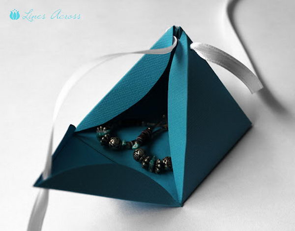 Paper Pyramid Gift Boxes. These little boxes are easy to open and close, and would be perfect for a little Mother's Day gift like earrings or a necklace. They are easy to reuse and a great thing to have on hand for last minute gifts.