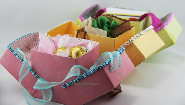 DIY Cube Favor Boxes. This Handmade Gift Favor Box is very unique because it opens both ways while the box stays in the middle.