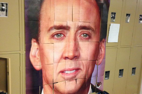 Nicolas Cage Photo Locker Decoration. A group of juniors taped segments of a photo of Nicholas Cage's face to lockers for decoration.