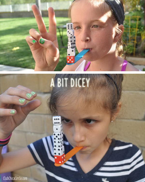 A Bit Dicey as a 15 Minute to Win It Party Game. While holding a craft stick in your mouth, player must stack 6 dice on top of each other on the end and hold for 3 seconds.
