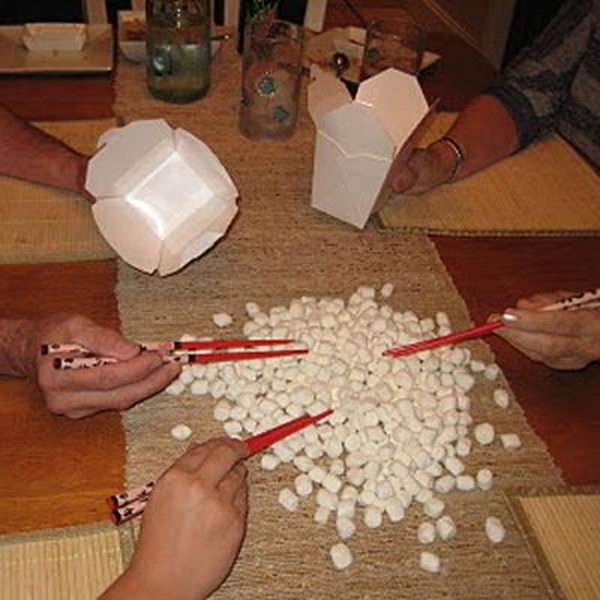 Pick Up Marshmallows Game as a 15 Minute to Win It Party Game. How many marshmallows can you pick up with chopsticks?