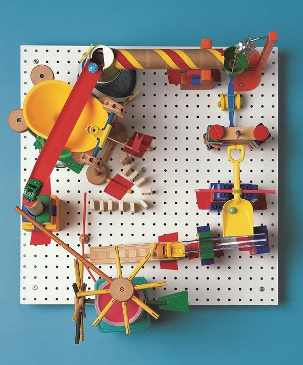 DIY Marble Run Craft, This peg-board marble run involves creating a clacking, whacking gumball machine that runs without electricity, all with parts found in the kitchen and toy box. A complete operation tutorial was provided.