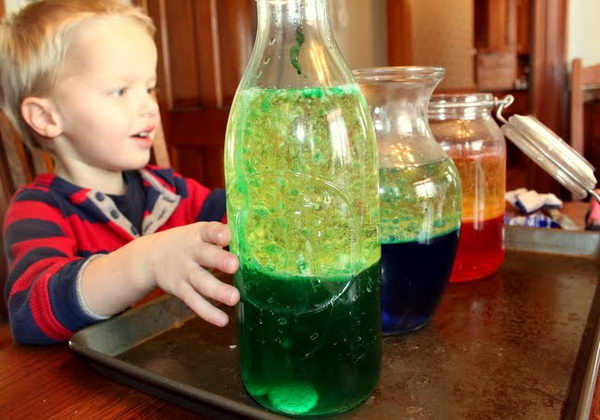 Lava Lamp Science Experiment for Kids. The Alka Seltzer reacts to make the Carbon dioxide bubbles. The bubbles stir the oil and colored water together.