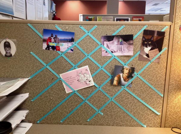 You can pin ribbon to the wall of the cubicle for a decorative photo collage.