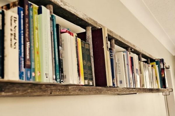 Hamg a ladder horizontally on the wall as a book shelf.