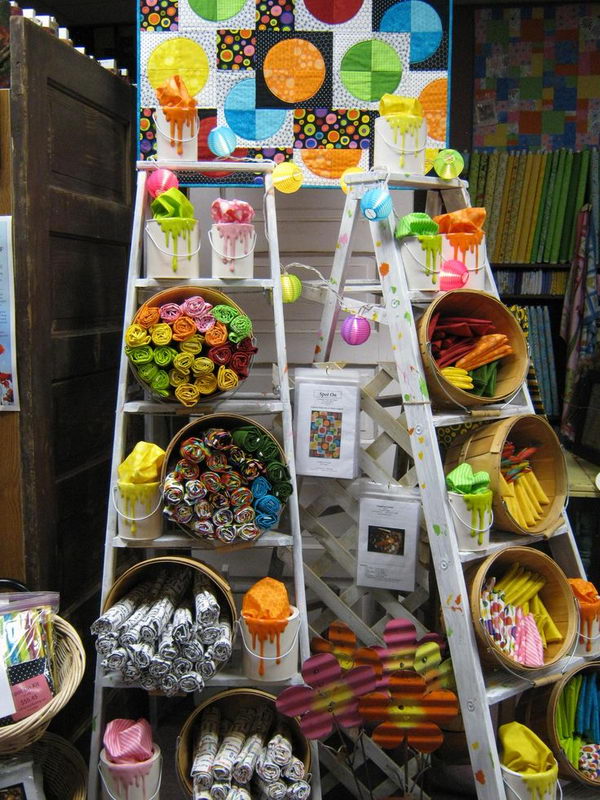 It is a decorative use of vintage ladders for arts and crafts show display, or retail store fixture.