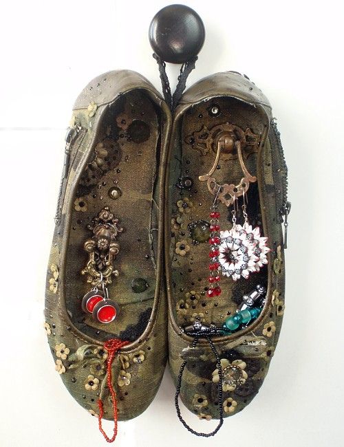 Vintage Shoes on Wall. The old shoes were decorated, sewn together and hung on the wall for storing jewelry or displaying unusual items.
