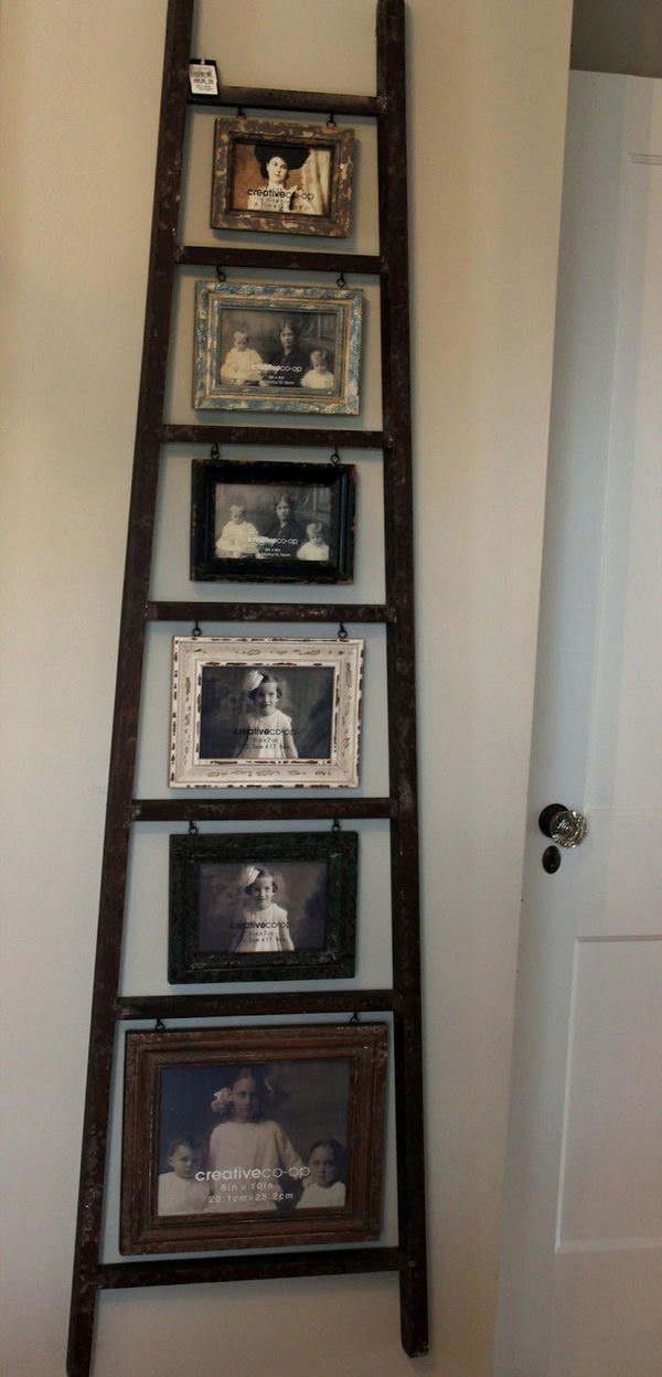 Old Ladder Photo Display. Turn an old ladder into a creative photo display with hanging frames.