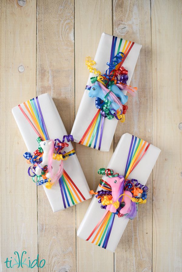 Easy Rainbow Ribbon Gift Wrap. Rainbow colors are perfect for a festive event, from kids or adult birthdays to anniversaries or graduation.