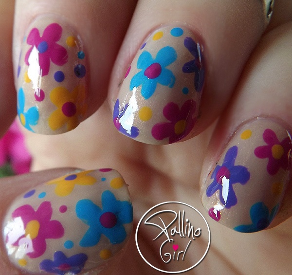 Pretty Flower Nail Art. These flower designs are so cute and make a regular manicure look like a piece of artwork.