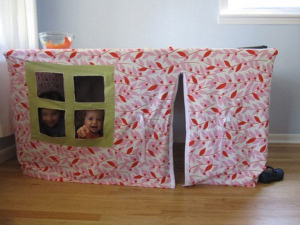 A playhouse under the table. Great idea to bring the fun indoors.