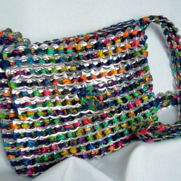 Make a purse out of can tabs with weaving. After drinking soda from aluminum cans, you can recycle your soda cans to create interesting projects instead of tossing the empty cans into the garbage or recycling bin.