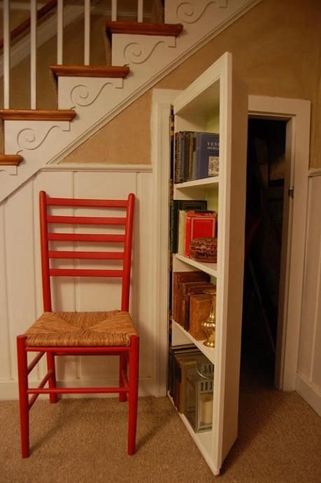 secret bookcase under stairs. The space under a staircase can be used to keep everyday clutter out of the way.