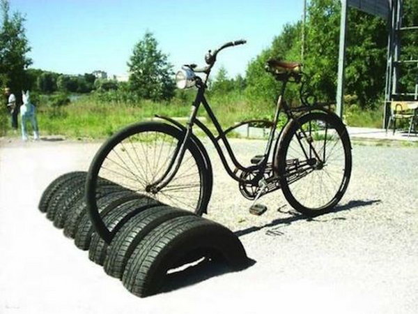 Reuse tires as bike storage.