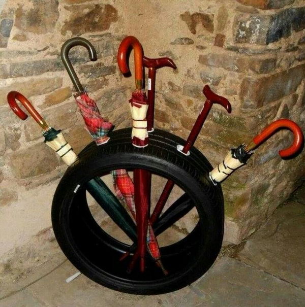 Old tire umbrella stand.