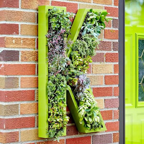 Living monogram wreath. It allows plants to extend upward rather than grow along the surface of the garden. Doesn’t take a lot of space and look so beautiful at the same time.