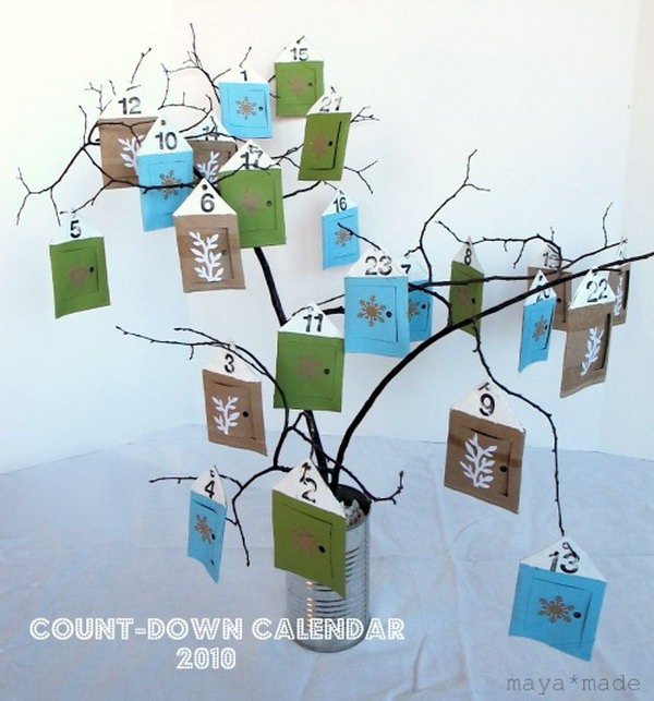 24 little houses are hung from a bouquet of bare winter branches as a advent calendar. This advent calendar is a fun, popular way for kids and adults to count down the days until Christmas. Kids would love the surprises hidden behind each day.