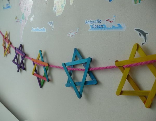 String the popsicle star of David together for Hanukkah decoration. 