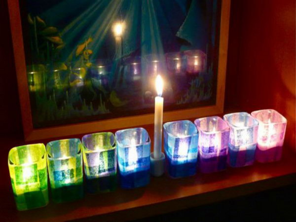 This colorful Hanukkah menorah is made from glass tea light holders and colored tissue paper. It is great for small spaces, and crafts up very quickly. 