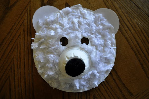 Polar bear mask made with paper plate, tissue paper and paper cup. 