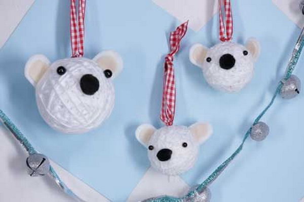 See how to put together the polar bear ornaments with styrofoam balls, yarn, and pom poms. 