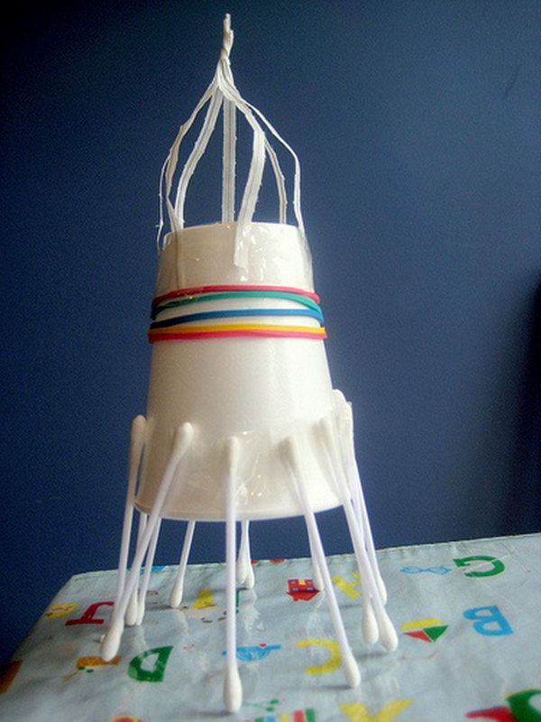 Junk model space rocket made from paper cup and cotton swabs. 