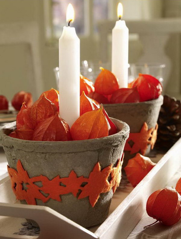 The idea of placing candles in small terra cotta pots is charming and effective. 