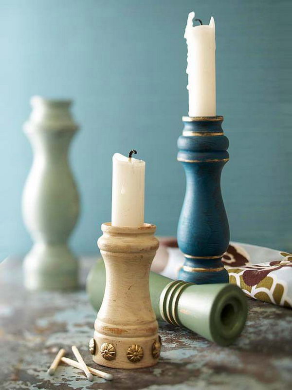 These old pepper grinders were hollowed, painted, and embellished with gold leafing and upholstery tacks to act as stylish candleholders. 