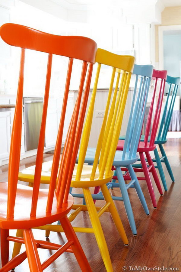Spray painting these chairs with different colors. The kitchen is now infused with a happy, fresh, and positive vibe. 