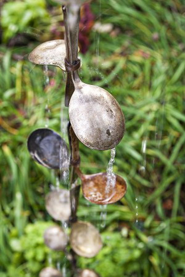 Rain chain out of salvaged spoons. Not only make a good sound and enhance your house exterior appearance, but also divert water away from your house.