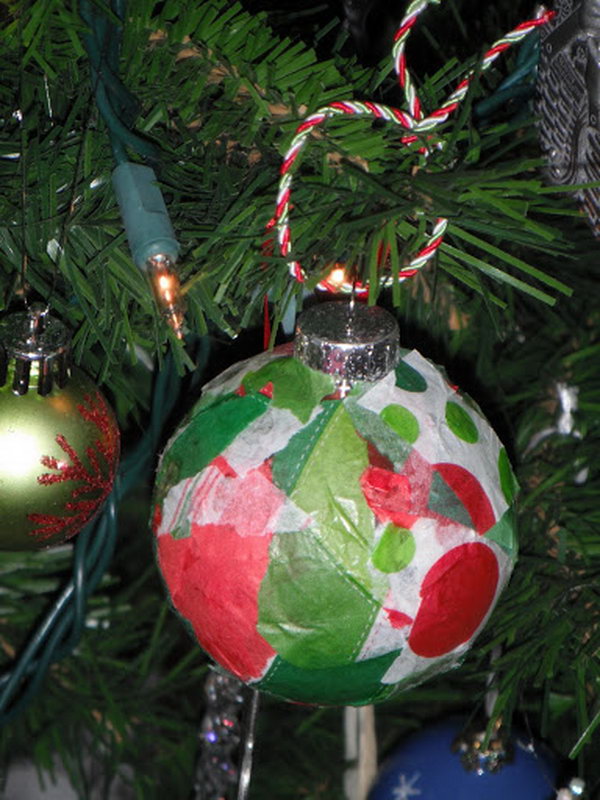Glass ornament with Christmas colored tissue paper glued onto the outside. So simple, yet so cute and frestive. 