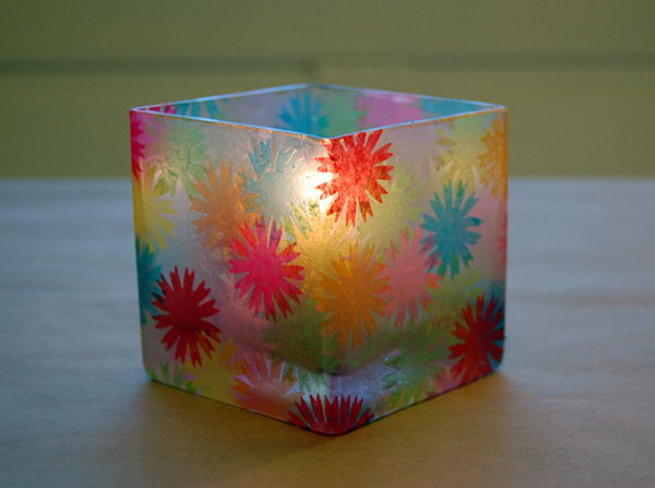Use these colorful tissue paper to decorate a glass container and make a votive holder. 