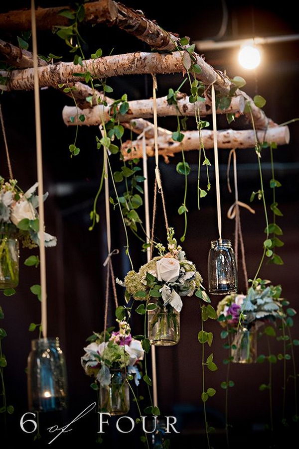 Natural elements, mason jars and the twig ladder make this wedding settings more than visually appealing. 