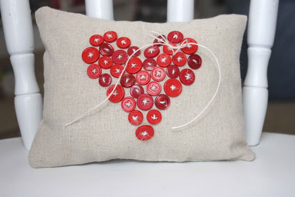 Decorate your pillow with a button heart shape. 