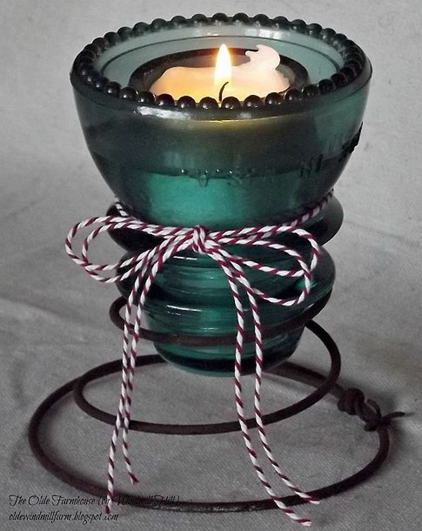 Rachel used rusty bed springs from a friend's back yard and an aqua glass insulator from his garage to create these cute little votive holders for a candlelit Valentine Party. 