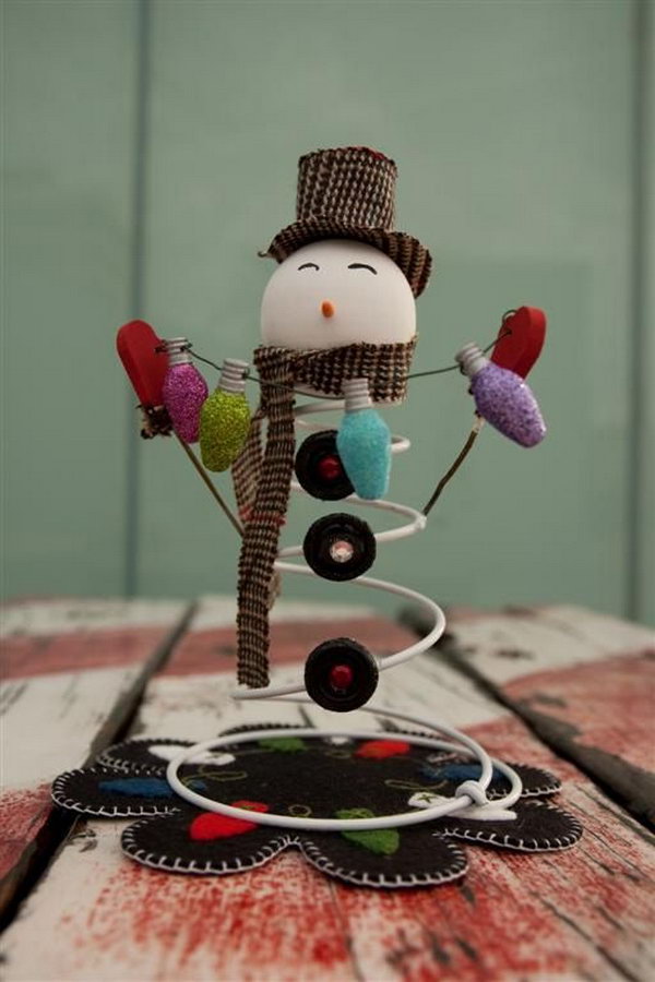 Adorable Snowman Made from an Old bed spring, a styrofoam ball and buttons, 