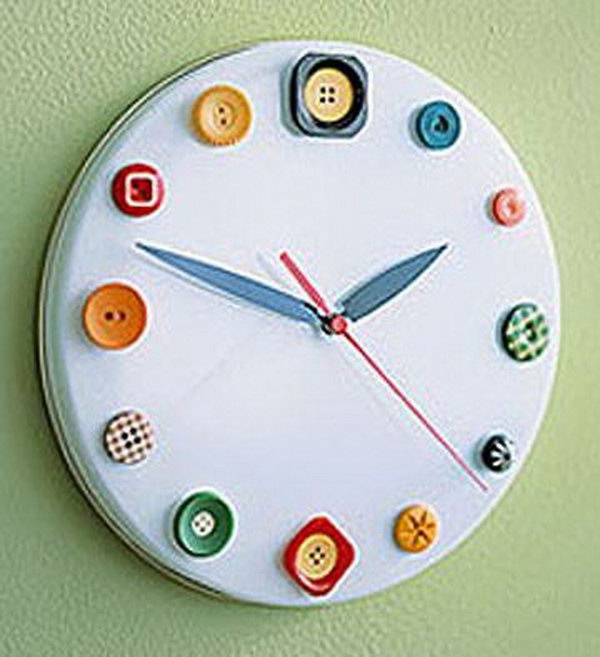 Button clock made out of a cookie tin lid, buttons, and clock parts. It is a great idea to help kids learn to read time. 