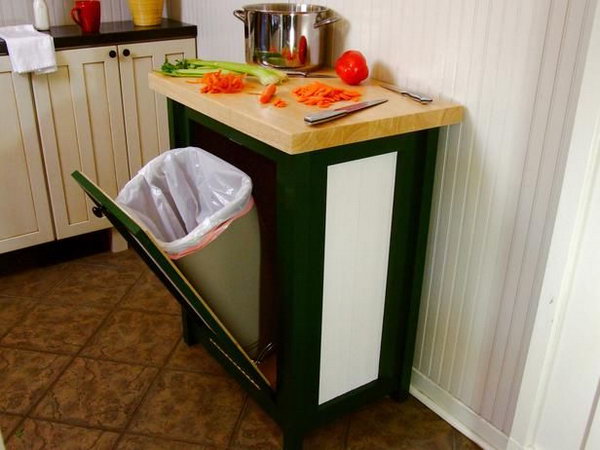 Hide your trash can in style with this tilt-open-door cabinet, and add a countertop for additional space in a little nook. 