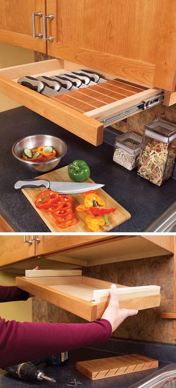 This pull out drawer under kitchen cabinet is perfect for storing knives. 