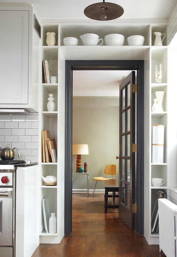 For things like jars or cups, you can create special storage compartments around the door frame. 
