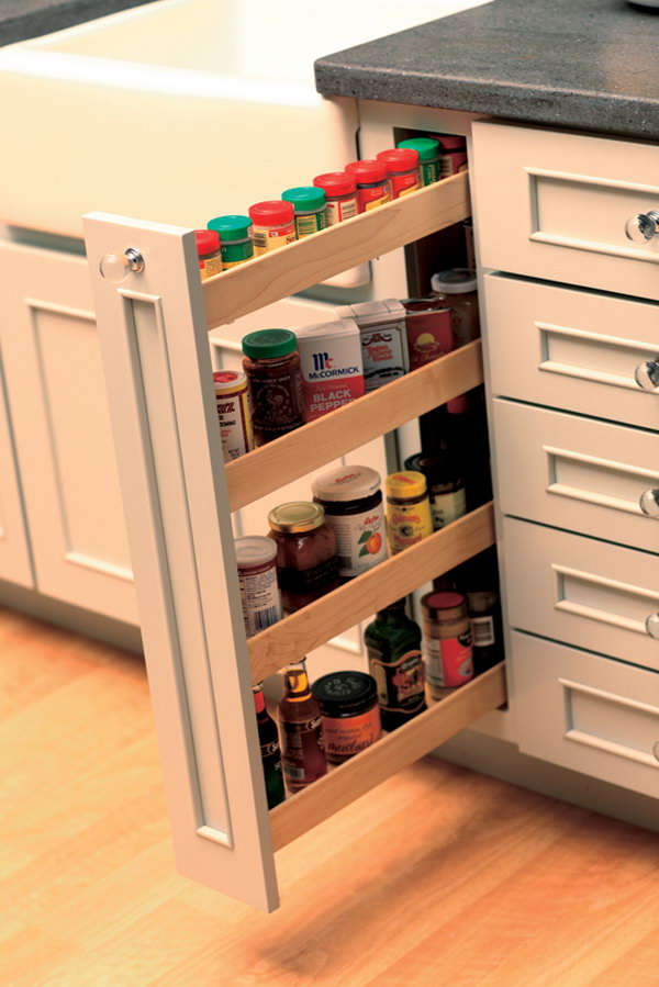In the kitchen, vertical racks are perfect for storing and organizing spices and other things. They take little space and they easily fit in the kitchen island or wall cabinets. 