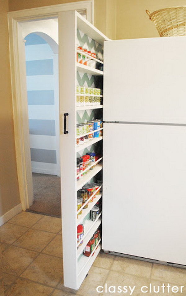 A diy rolling canned food organizer made by Classy Clutter. It uses the small space between the wall and refrigerator. 