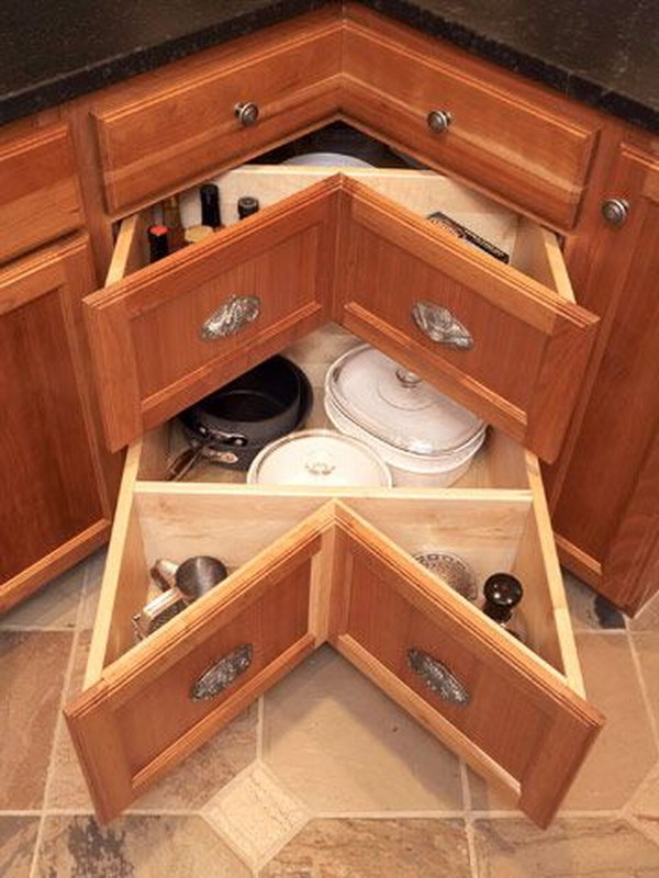Instead of having the long dark cave of a cabinet, the corner sliding drawers make better use of your counter corners. 