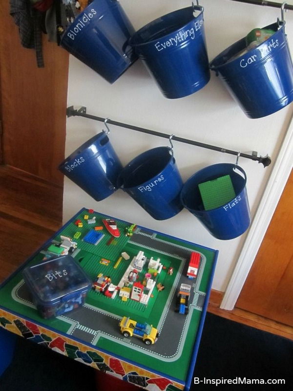 Hanging wall LEGO storage system made from curtain rods, hooks and plastic buckets. It’s easy for kids to see everything and take down and put back his buckets by himself. 