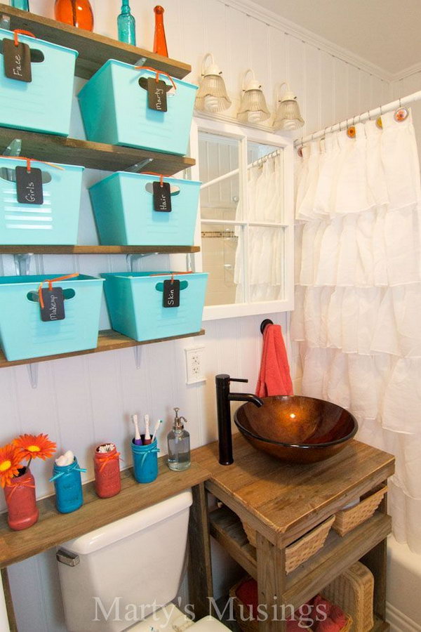 Extend space over the toilet for more storage with the fence board shelves and dollar store baskets. 