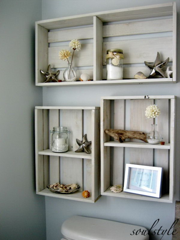 Hang some DIY crates on the area over the toilet to add some decor. The dried beach dahlias in tiny bubble vases, mason jars filled with candles & bath salts, some driftwood, and a few starfish & shells make your bathroom super-fantastic. 