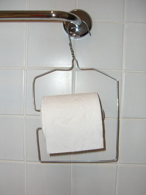 This wire clothes hanger was upcycled into a toilet paper holder. 